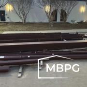 Steel Building Materials Sitting on Concrete