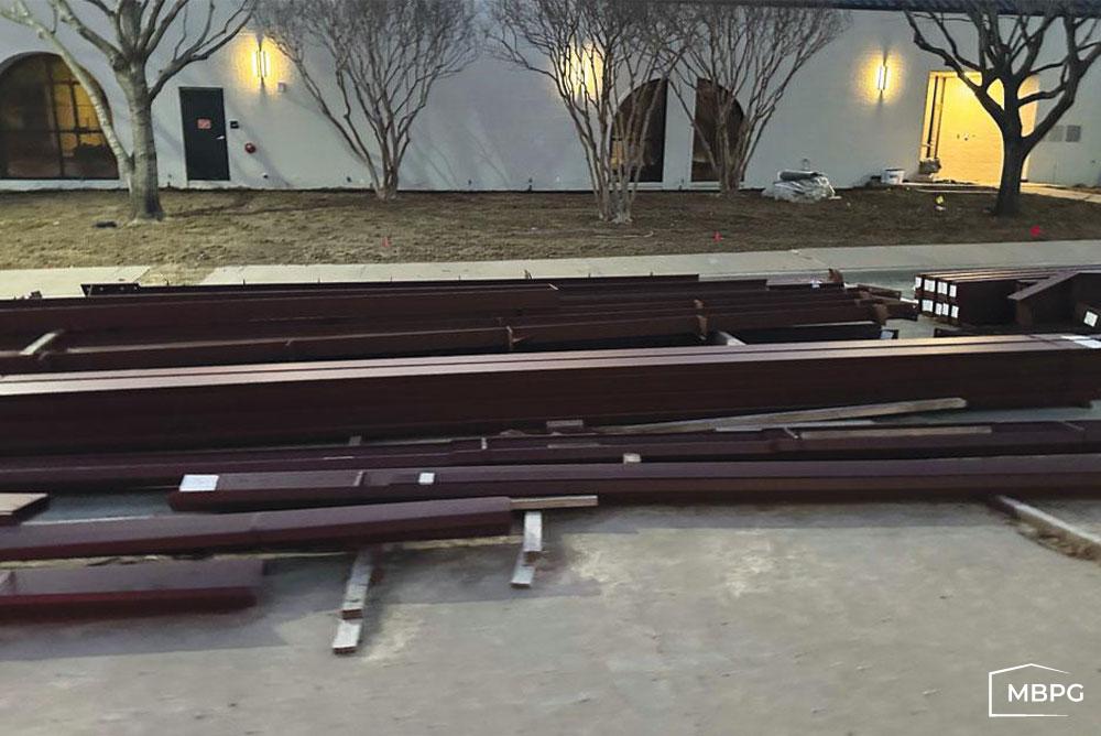 TX1767 Steel Building Materials Sitting on Concrete