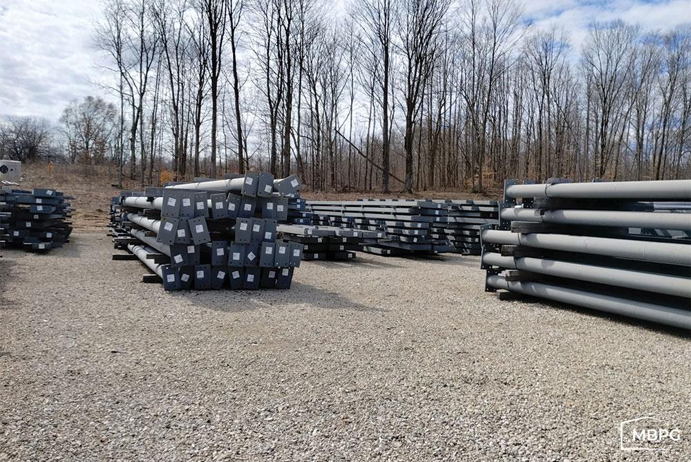 Steel Building Parts Sitting on Gravel