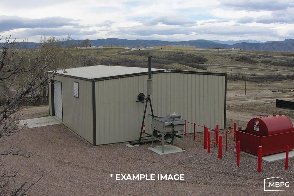 Brown Metal Building on a Dirt Lot