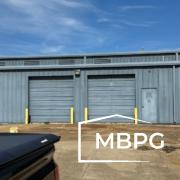 Blue Used Metal Building with Two Roll Up Doors