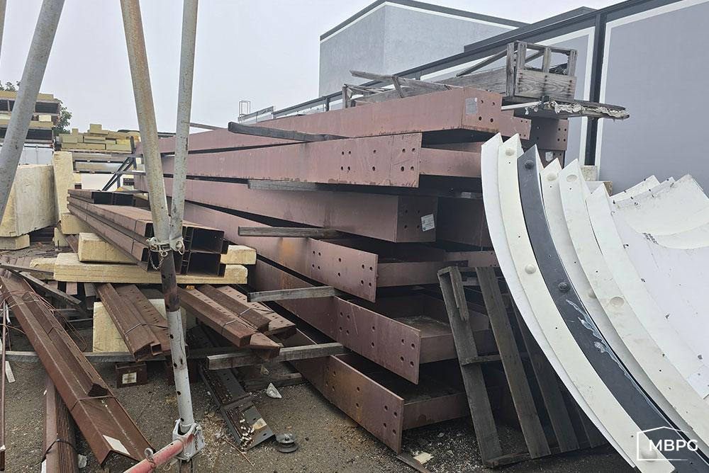 Red Iron Materials Stacked on Pallets