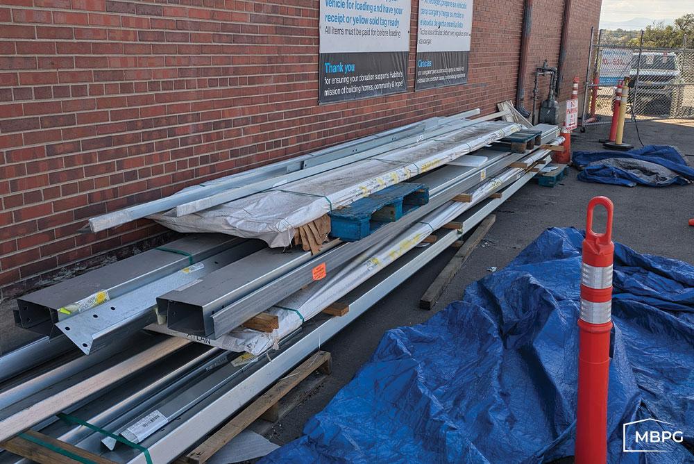 CO1801-1 | Cold Formed Steel on Pallets in Front of a Brick Wall Cold Formed Steel on Pallets in Front of a Brick Wall