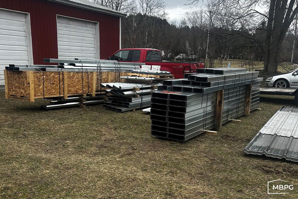 MI1798 | Steel Building Materials Laying on Grass Steel Building Materials Laying on Grass