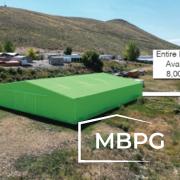 Metal Hangar Building on a Hill