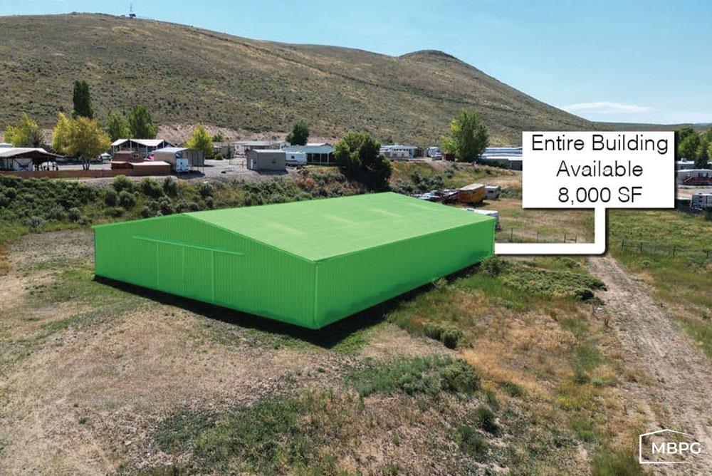 Metal Hangar Building on a Hill