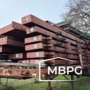 Used Red Iron Materials Loaded on a Trailer