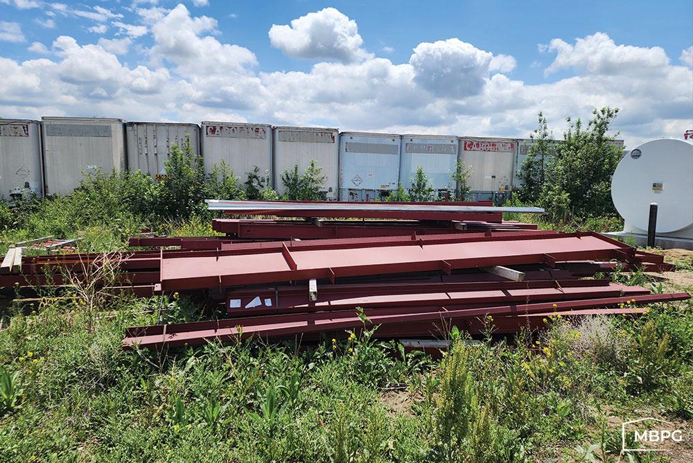 CO1820 | Used Red Iron Materials Loaded on grass Used Red Iron Materials Loaded on grass