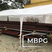 Metal Building Materials Under a Tent