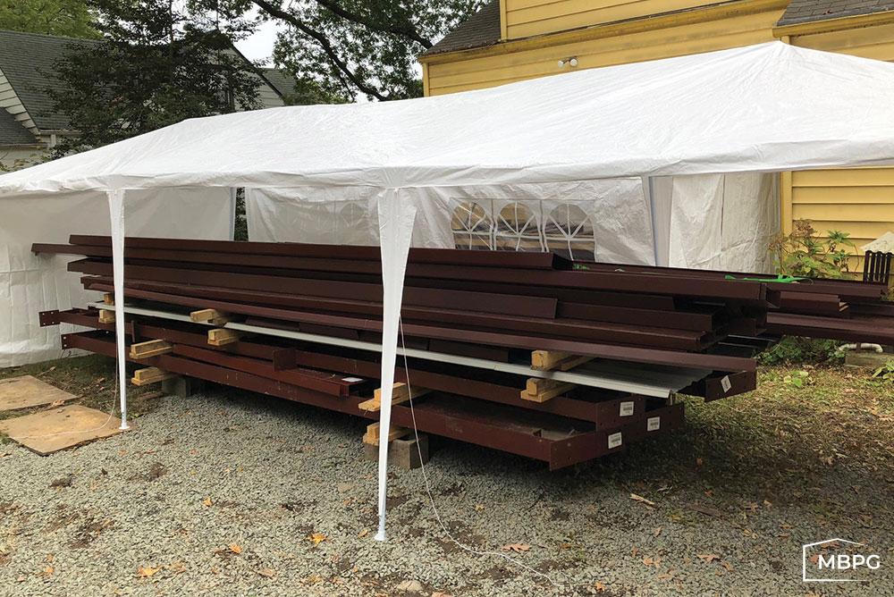 VA1819 | Metal Building Materials Under a Tent Metal Building Materials Under a Tent