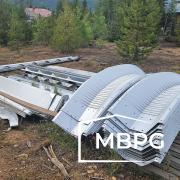 Metal Arch Building Materials on Ground