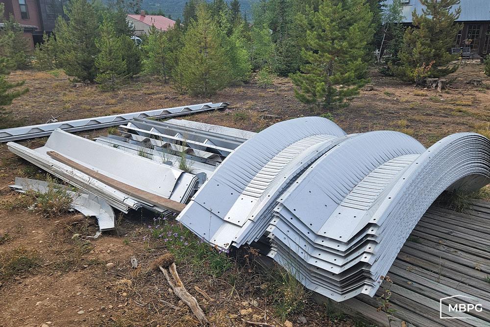 CO1827 Metal Arch Building Materials on Ground